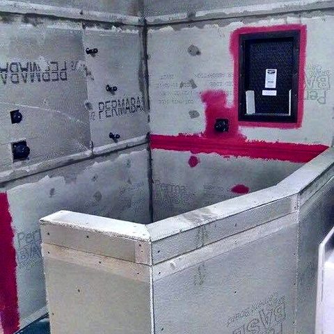 The shower rebuilt in cement board with waterproofing membrane sealed into every seam